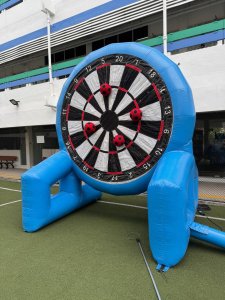 Quick setup of soccer dart inflatable game for a corporate team building event in Singapore