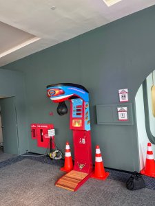 Guest testing strength on punching machine at indoor corporate event