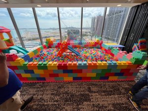 Children playing in colorful ball pit at indoor carnival setup