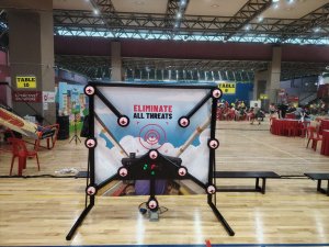 Kids playing Flash Dash reaction game at an indoor carnival event in Singapore