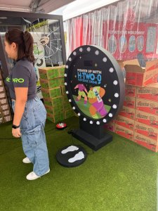 Child running in place on Speed Runner game at an indoor school event