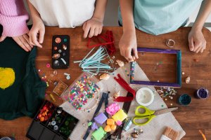 students and teachers creating diy school carnival games for a school event in singapore