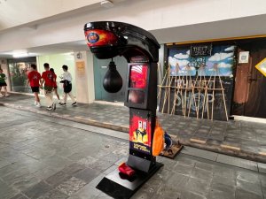 Arcade punch machine strength tester game at a corporate team building event in Singapore