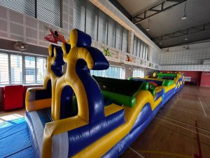 Friendship themed inflatable obstacle course promoting teamwork at community events in Singapore