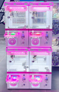 Mini claw machine arcade game with prize grabbing challenge for carnival events in Singapore