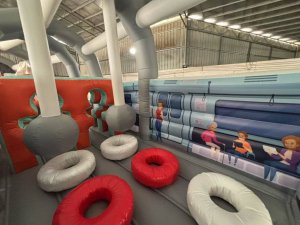 Singapore MRT train themed inflatable obstacle course used for community carnival events